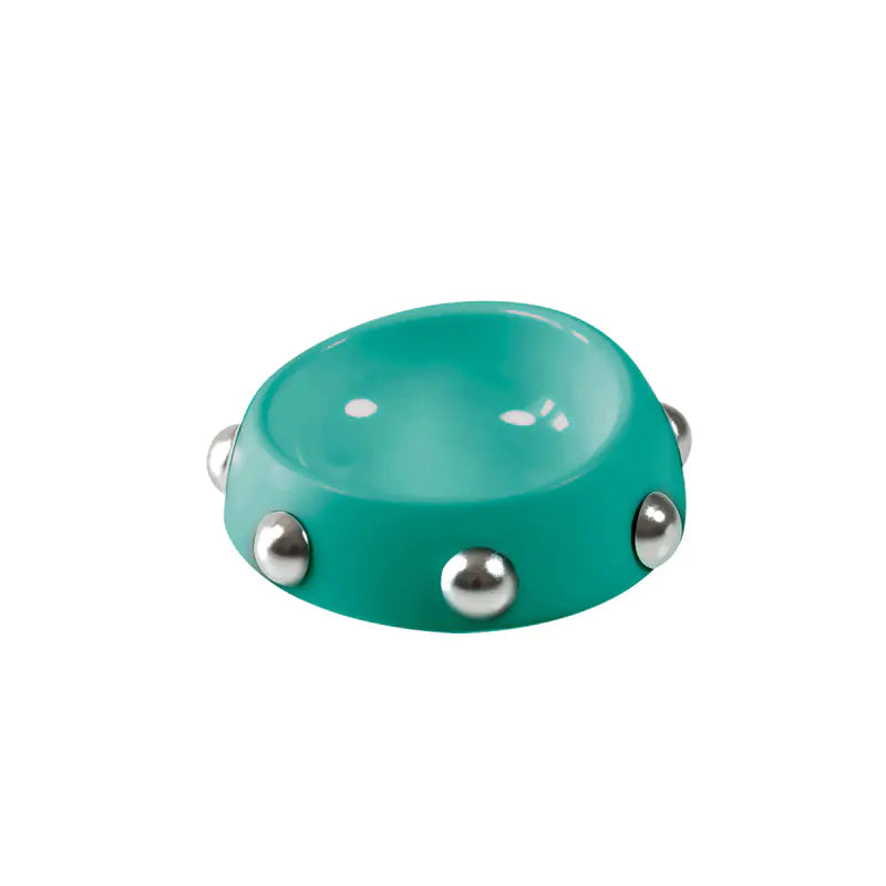 Turquoise bowl with silver jingles on a white background