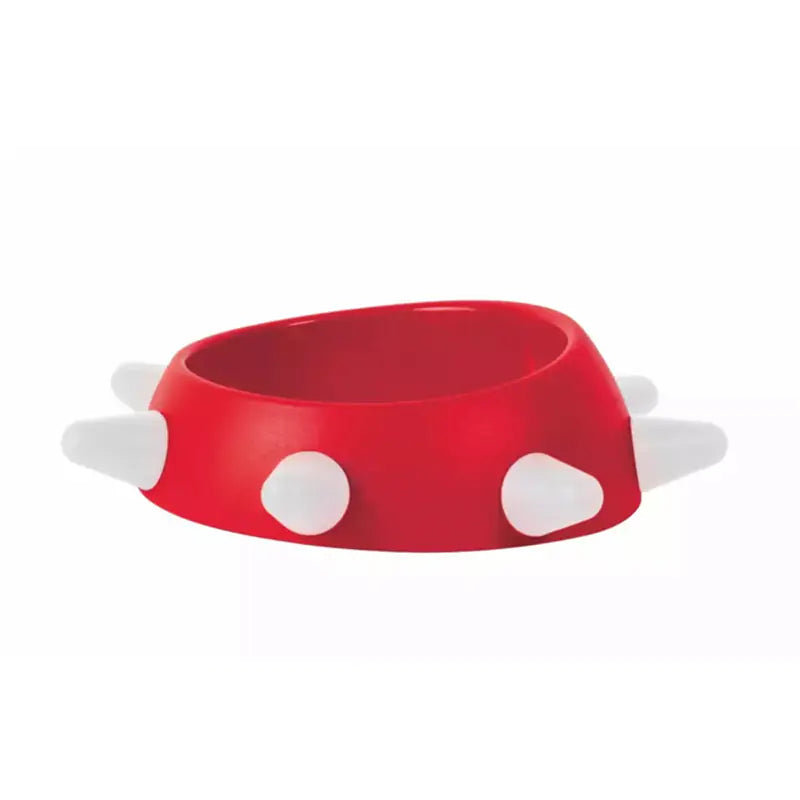 Red bowl with white polka dots on a white background