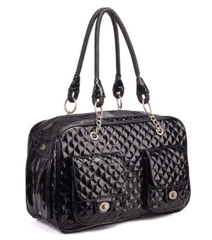 Black quilted handbag with braided handle on a white background