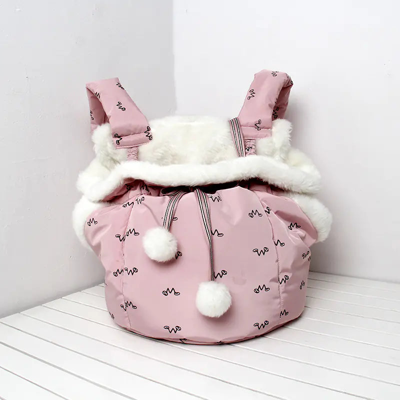 Pink pet carrier with white fur on a white background